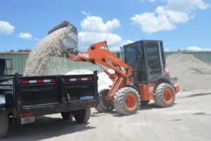  Larson Topsoil's Hitachi ZW50 compact loaders load mulch, rock, gravel, sand topsoil, potting soil and shell